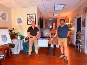 Carl Forsythe with visitors at his show at Phi Gallery.